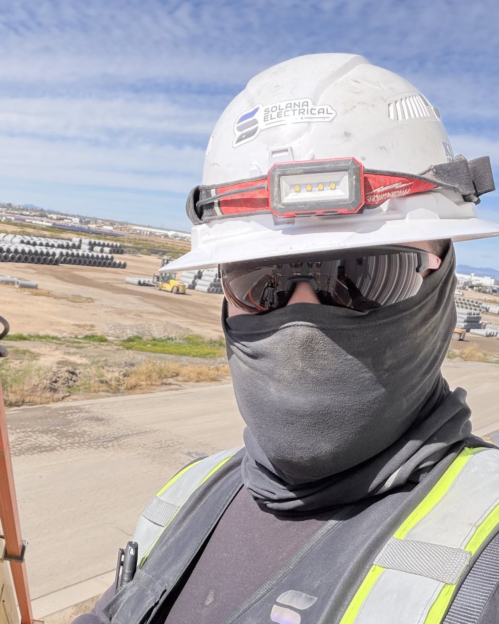 Solana Electrical electrician in a hard hat and safety vest on a job site